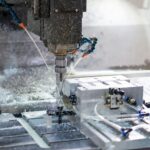 A machine that is cutting a piece of metal